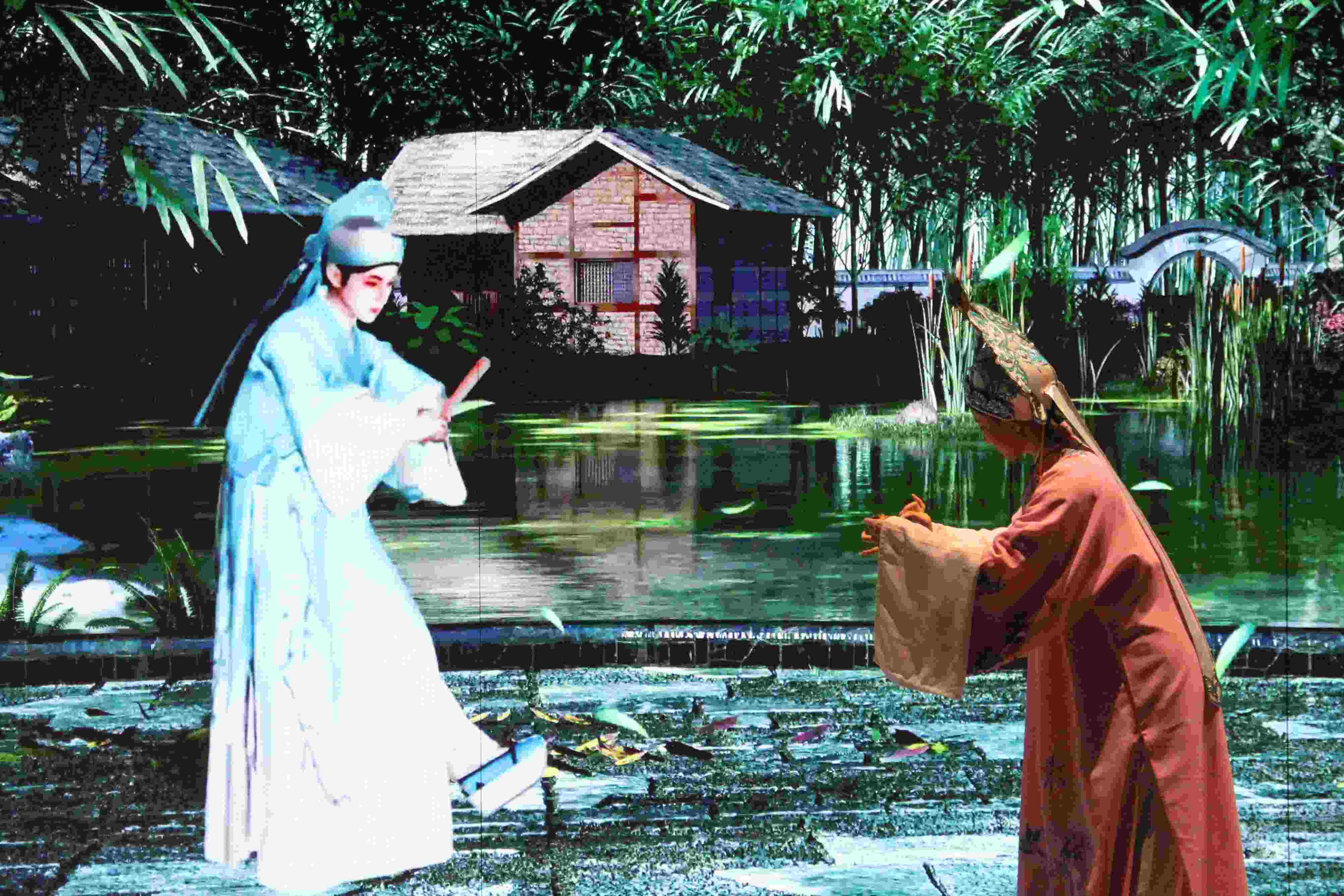 真人演員與虛擬人演員在“元啟金陵”南京數(shù)字文化客廳出演《梁山伯與祝英臺(tái)》經(jīng)典選段。受訪者供圖