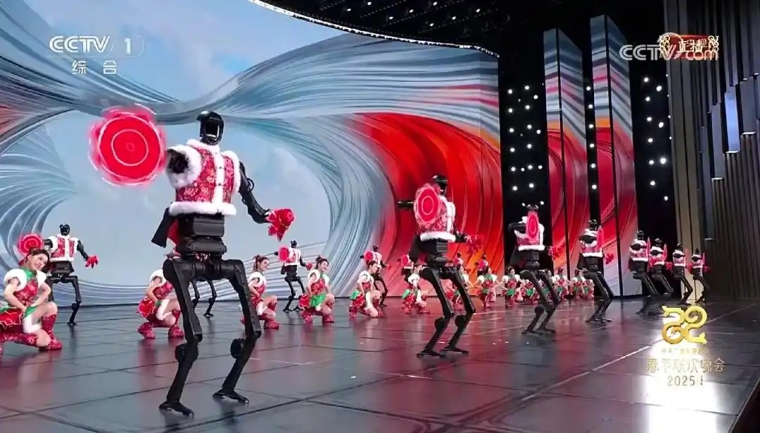△今年春晚，宇樹科技人形機(jī)器人身穿東北特色的花棉襖扭秧歌，呈現(xiàn)出全新視覺效果。